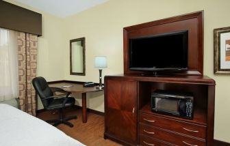 Day use room with TV and work area at Hampton Inn & Suites Conroe - I-45 North.