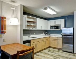 In-room kitchen at Homewood Suites By Hilton Chicago-Downtown.
