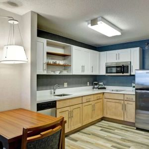 In-room kitchen at Homewood Suites By Hilton Chicago-Downtown.