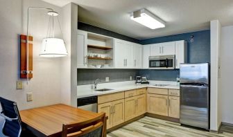 In-room kitchen at Homewood Suites By Hilton Chicago-Downtown.