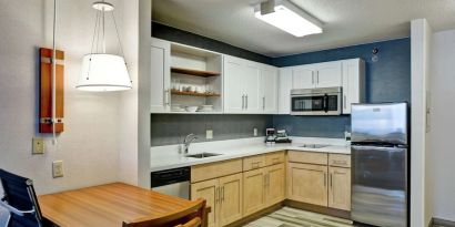 In-room kitchen at Homewood Suites By Hilton Chicago-Downtown.