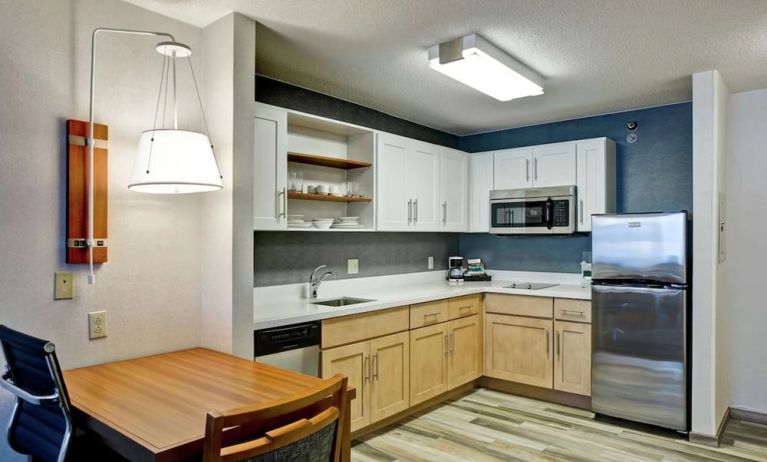 In-room kitchen at Homewood Suites By Hilton Chicago-Downtown.