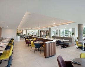 Lounge and coworking space at Hampton By Hilton London Stansted Airport.