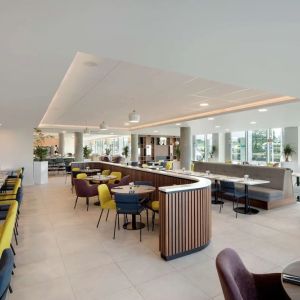 Lounge and coworking space at Hampton By Hilton London Stansted Airport.