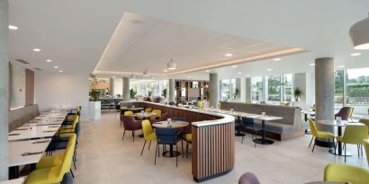 Lounge and coworking space at Hampton By Hilton London Stansted Airport.