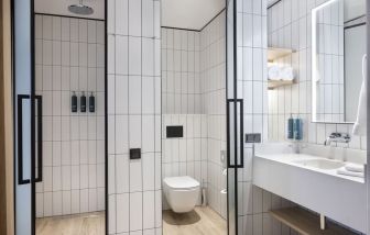 Guest bathroom with shower at Hilton Garden Inn Tbilisi Riverview.