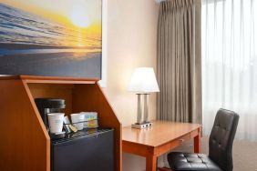 Dedicated work station and mini-fridge at Days Inn Miami International Airport,