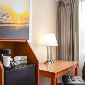 Dedicated work station and mini-fridge at Days Inn Miami International Airport,