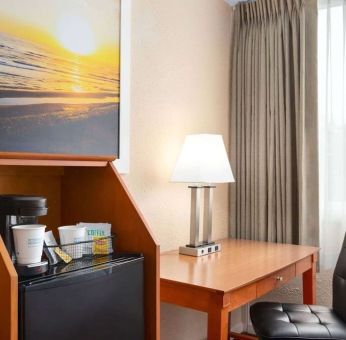 Dedicated work station and mini-fridge at Days Inn Miami International Airport,