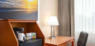 Dedicated work station and mini-fridge at Days Inn Miami International Airport,