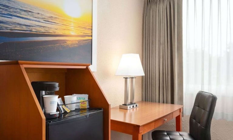 Dedicated work station and mini-fridge at Days Inn Miami International Airport,