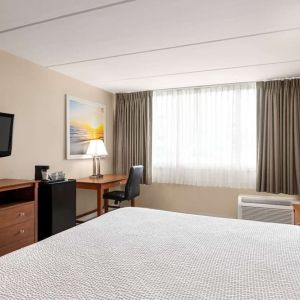 Day use room with TV and work space at Days Inn Miami International Airport,