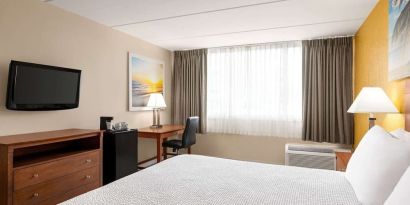 Day use room with TV and work space at Days Inn Miami International Airport,