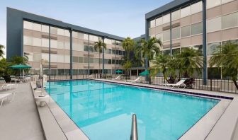 Beautiful outdoor pool at EnVision Hotel Miami International Airport.