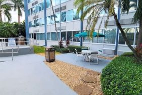 Outdoor garden and terrace at Days Inn Miami International Airport,