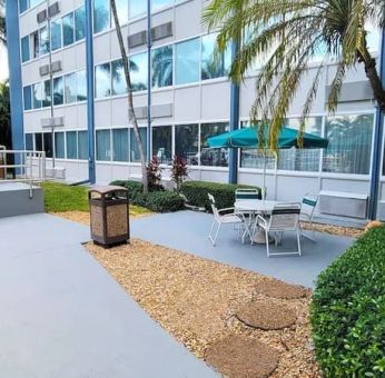 Outdoor garden and terrace at Days Inn Miami International Airport,