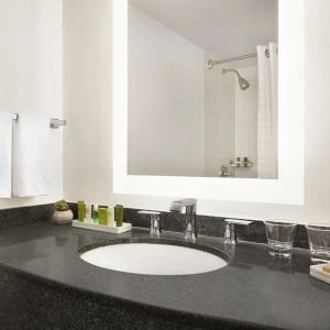 Guest bathroom with shower at Hilton Scottsdale Resort & Villas.