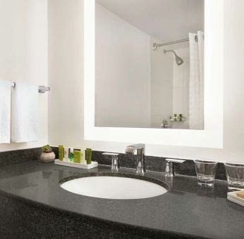 Guest bathroom with shower at Hilton Scottsdale Resort & Villas.