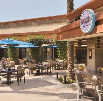 Sunny outdoor terrace at Hilton Scottsdale Resort & Villas.