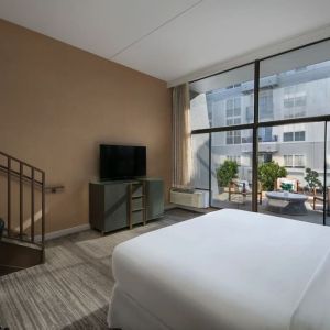 Spacious king room with balcony at Hotel Dena, Pasadena Los Angeles.