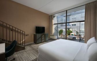 Spacious king room with balcony at Hotel Dena, Pasadena Los Angeles.