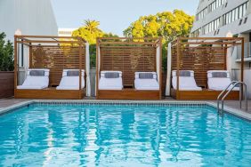 Pool cabanas and pool chairs at Hotel Dena, Pasadena Los Angeles.