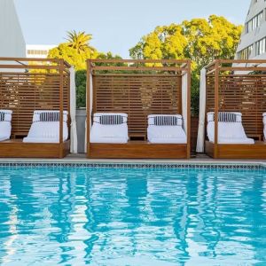 Pool cabanas and pool chairs at Hotel Dena, Pasadena Los Angeles.