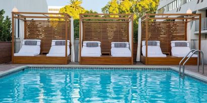 Pool cabanas and pool chairs at Hotel Dena, Pasadena Los Angeles.