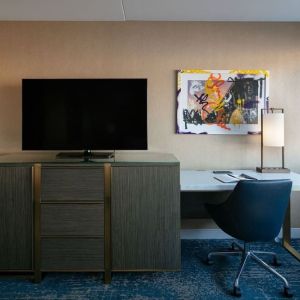 King room with TV and work station at Hotel Dena, Pasadena Los Angeles.