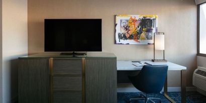 King room with TV and work station at Hotel Dena, Pasadena Los Angeles.