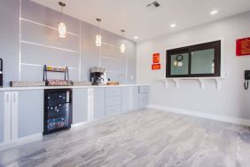 Kitchen and dining area at Palace Inn I-10 West & Beltway 8.