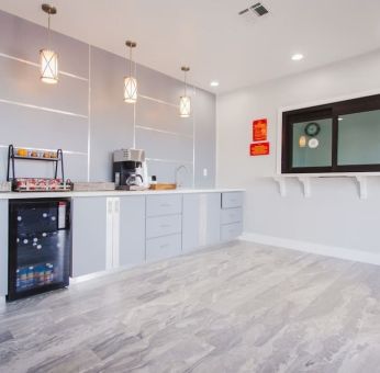 Kitchen and dining area at Palace Inn I-10 West & Beltway 8.