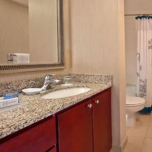 Guest bathroom with shower at Residence Inn Boston Tewksbury.
