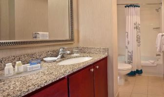 Guest bathroom with shower at Residence Inn Boston Tewksbury.
