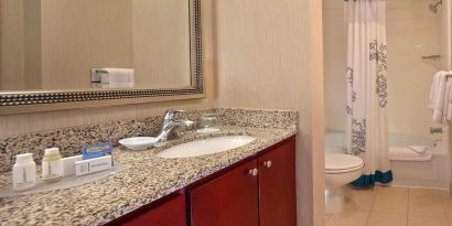 Guest bathroom with shower at Residence Inn Boston Tewksbury.
