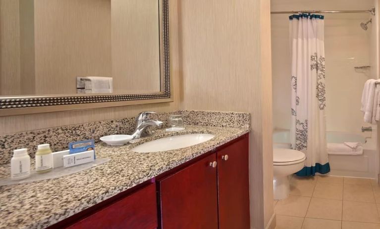 Guest bathroom with shower at Residence Inn Boston Tewksbury.
