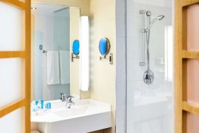 Guest bathroom with shower at Novotel Toronto North York.