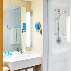 Guest bathroom with shower at Novotel Toronto North York.