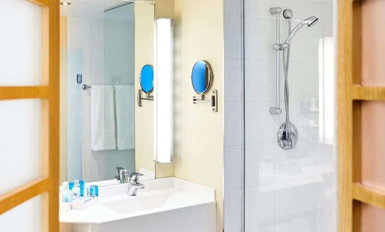 Guest bathroom with shower at Novotel Toronto North York.