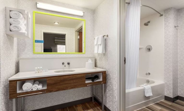 Guest bathroom with shower at Hampton Inn & Suites Miami Kendall.