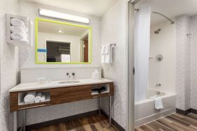 Guest bathroom with shower at Hampton Inn & Suites Miami Kendall. 