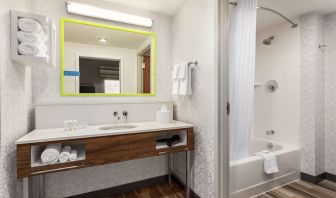 Guest bathroom with shower at Hampton Inn & Suites Miami Kendall. 