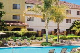 Relaxing pool area with lounges at the DoubleTree by Hilton Sonoma Wine Country.