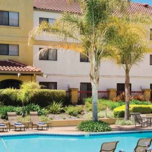 Relaxing pool area with lounges at the DoubleTree by Hilton Sonoma Wine Country.