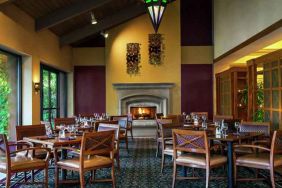 Dining area by the fireplace perfect for co-working at the DoubleTree by Hilton Sonoma Wine Country.