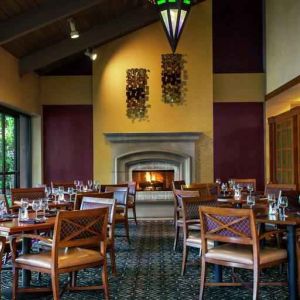 Dining area by the fireplace perfect for co-working at the DoubleTree by Hilton Sonoma Wine Country.