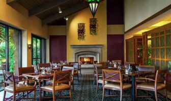 Dining area by the fireplace perfect for co-working at the DoubleTree by Hilton Sonoma Wine Country.