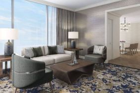 Spacious king room with lounge area at Hilton BNA Nashville Airport Terminal.