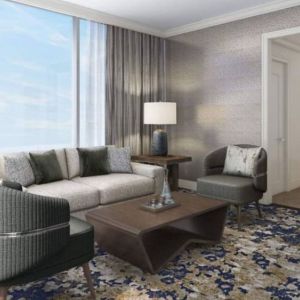 Spacious king room with lounge area at Hilton BNA Nashville Airport Terminal.