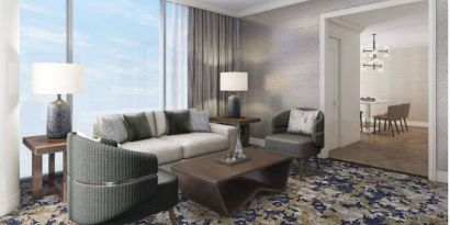 Spacious king room with lounge area at Hilton BNA Nashville Airport Terminal.